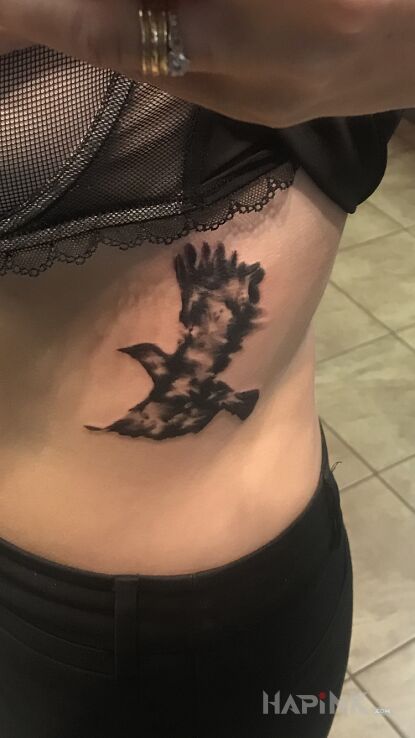 Tattoo Cover in animals motif and graphic / illustrative style on the ribs