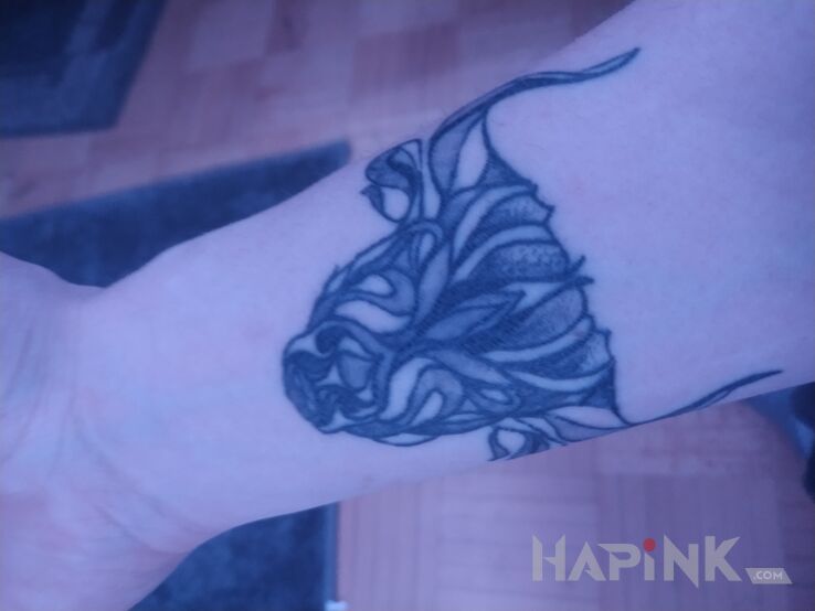 Tattoo Byk in black and gray motif and graphic / illustrative style on the forearm