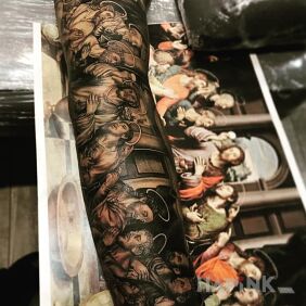 Tattoo Last Supper on the upper arm motif: sleeves style: realistic
