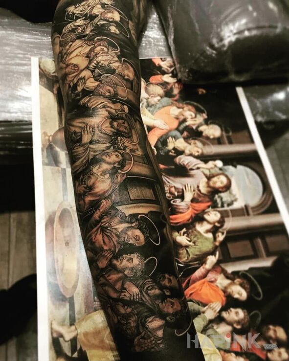 Tattoo Ostatnia wieczerza in sleeves motif and realistic style on the forearm