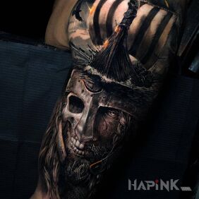 Tattoo Half-dead Viking on the upper arm motif: faces style: realistic