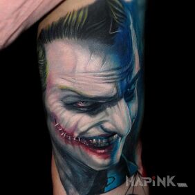 Tattoo Joker on the upper arm motif: characters
