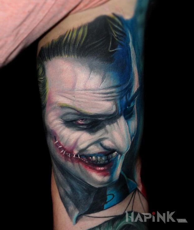 Tattoo Joker in characters motif on the upper arm