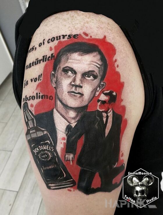 Tattoo Jurek in characters motif and realistic style on the upper arm