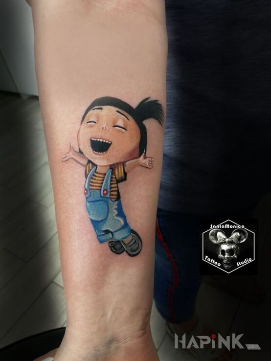 Tattoo Minionki in faces motif and cartoon / comic book style on the forearm