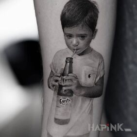 Tattoo Boy with a bottle of fanny on the forearm motif: faces style: realistic