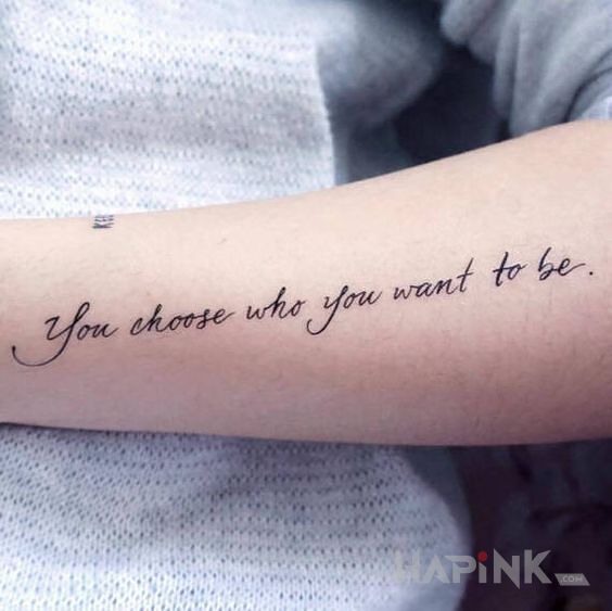 Tattoo Życiowy wybór in lettering motif and calligraphy style on the forearm