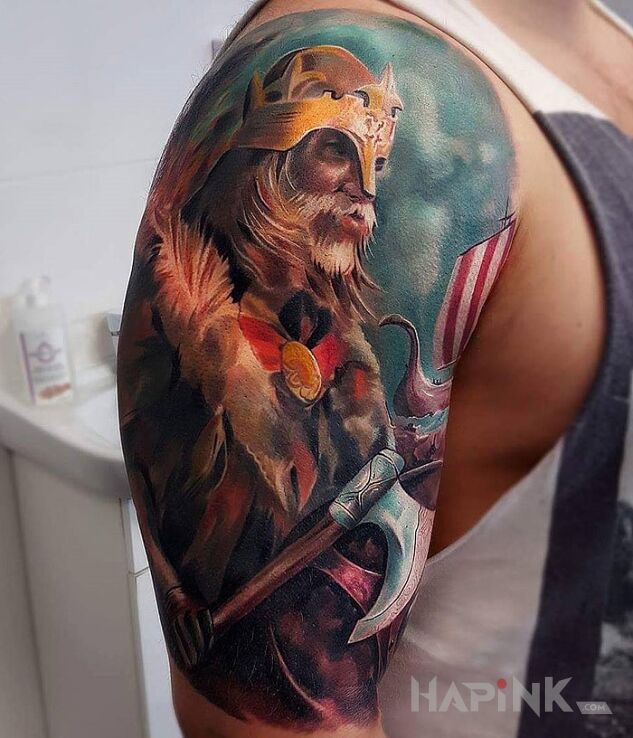 Tattoo Wiking in characters motif on the upper arm