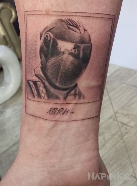 Tattoo Motocyklista. in motorization motif and graphic / illustrative style on the forearm