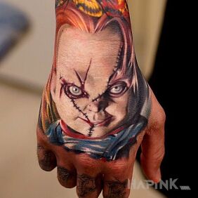 Tattoo Chucky doll on the hand motif: characters
