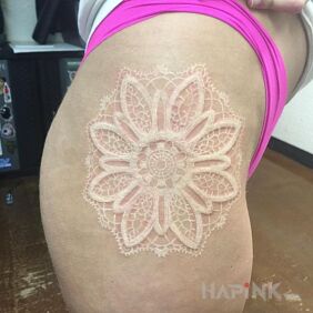 Tattoo White ink on the leg motif: mandalas style: white ink