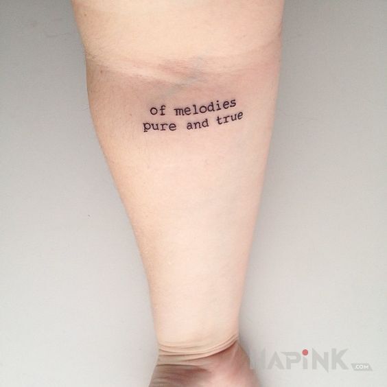 Tattoo Czyste i prawdziwe in lettering motif and calligraphy style on the forearm