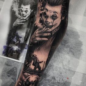 Tattoo New joker on the leg motif: black and gray style: realistic