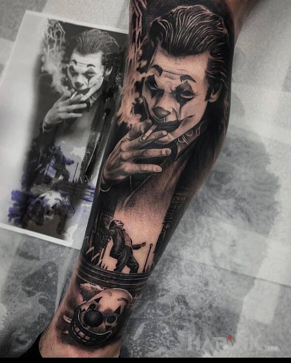 Tattoo Nowy joker in black and gray motif and realistic style on the calf
