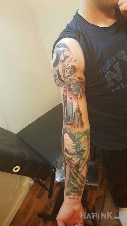 Tattoo Batman i joker in sleeves motif on the forearm