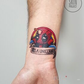 Tattoo Unicorn on the forearm motif: colorful style: cartoon / comic book