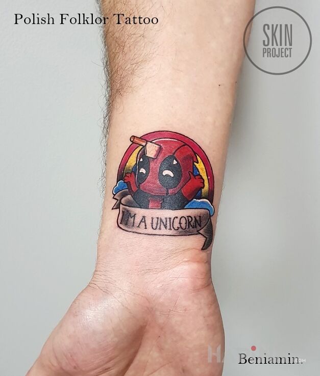 Tattoo Unicorn in characters motif and cartoon / comic book style on the forearm