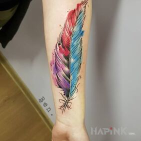Tattoo Feather on the forearm motif: colorful style: Watercolor
