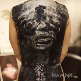Tattoo Blindfolded on the back motif: characters