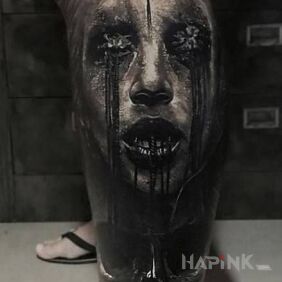 Tattoo A frightening sight on the calf motif: dark style: realistic