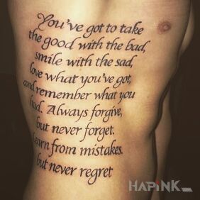 Tattoo Lyrics on the ribs motif: lettering style: calligraphy