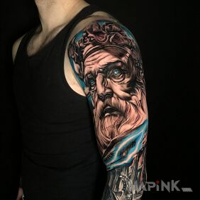 Tattoo Greek gods - Zeus on the upper arm motif: black and gray style: realistic