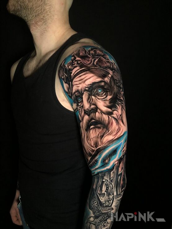 Tattoo Bogowie greccy - zeus in black and gray motif and realistic style on the upper arm