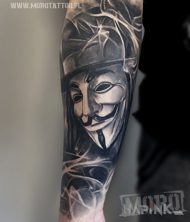 Tattoo Wygojony, V for Vendetta in characters motif and realistic style on the forearm