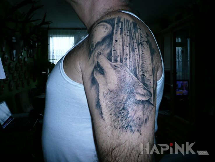 Tattoo Basior in animals motif on the upper arm
