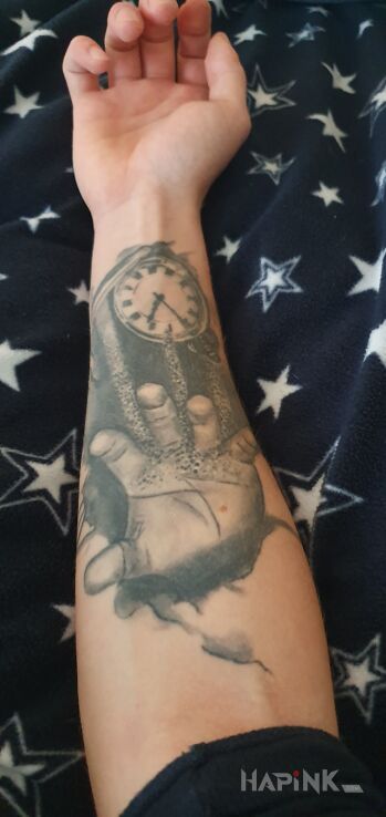 Tattoo Piasek in objects motif and realistic style on the forearm