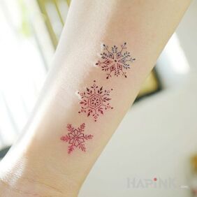 Tattoo Snowflakes on the forearm motif: colorful style: minimalistic