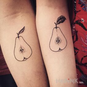Tattoo One pear two halves on the forearm motif: other style: minimalistic