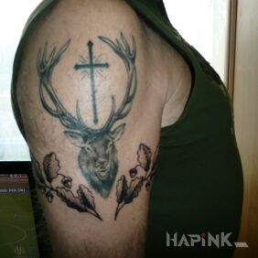 Tattoo St.Hubert on the upper arm motif: religious