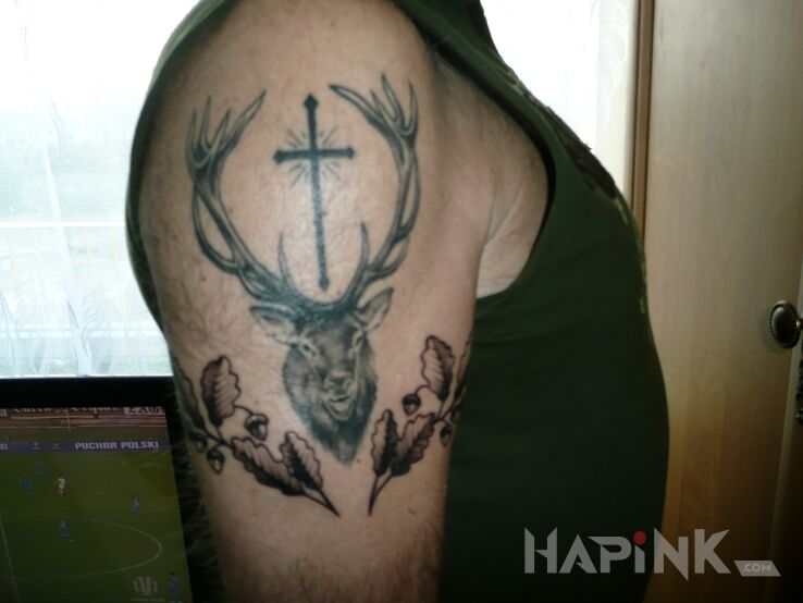 Tattoo Św.Hubert in religious motif on the upper arm