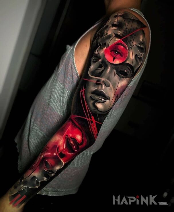 Tattoo Same twarze in sleeves motif and surrealistic style on the upper arm