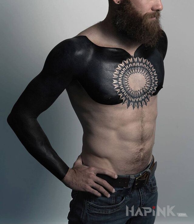Tattoo Czarno to widzę in sleeves motif and blackwork / blackout style on the collarbone