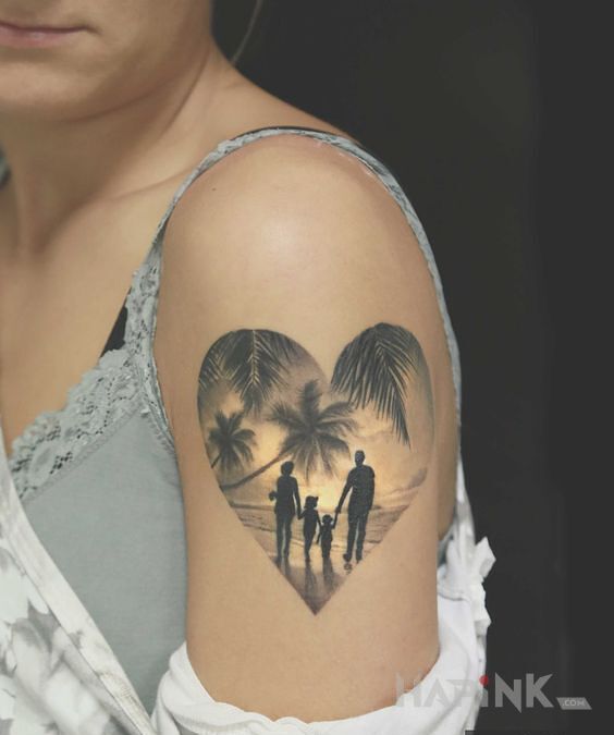 Tattoo Rodzinnie pod palmami in black and gray motif and realistic style on the upper arm