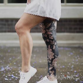 Tattoo Black leg on the calf motif: flowers style: blackwork / blackout