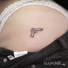 Tattoo Gun on the buttocks motif: objects style: minimalistic
