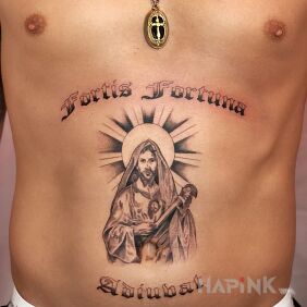 Tattoo Happiness on the stomach motif: lettering style: calligraphy
