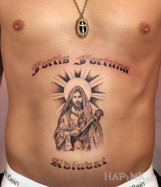 Tattoo Szczęście in religious motif and graphic / illustrative style on the stomach