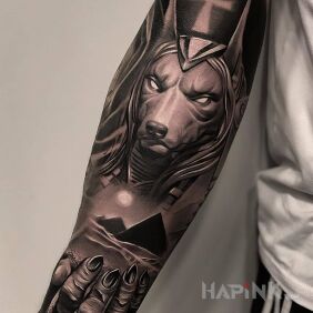 Tattoo Pyramids on the forearm motif: black and gray style: realistic