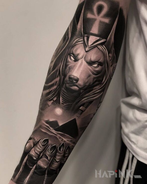 Tattoo Piramidy in characters motif and realistic style on the forearm