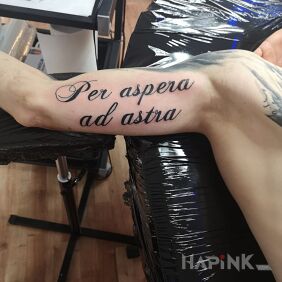 Tattoo Inscription on the beat on the upper arm motif: lettering style: calligraphy