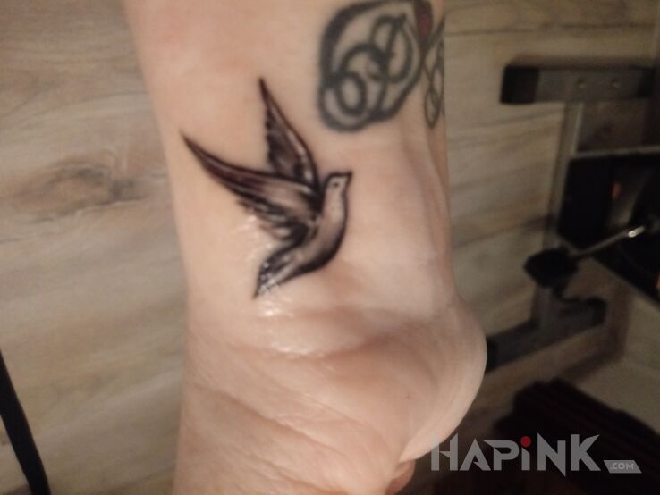 Tattoo Gołąbek in santa muerte motif and graphic / illustrative style on the wrist