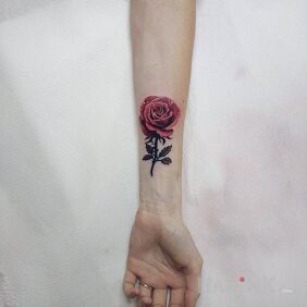 Tattoo Rose (caption cover) on the forearm motif: colorful style: realistic