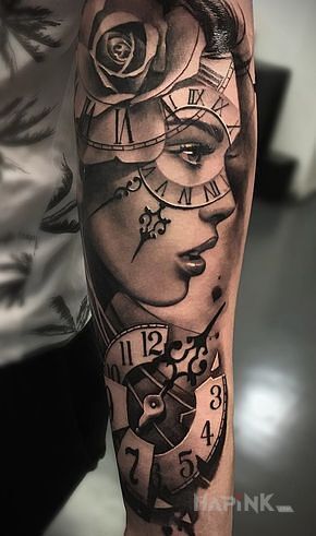 Tattoo Zegar na oku in flowers motif and realistic style on the forearm