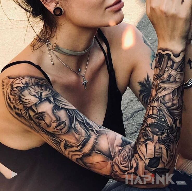 Tattoo Klauny w natarciu in faces motif and chicano style on the upper arm