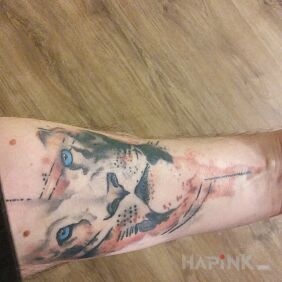 Tattoo Lion on the forearm motif: animals style: Watercolor