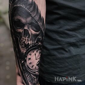 Tattoo Watchmaker on the forearm motif: skulls style: realistic